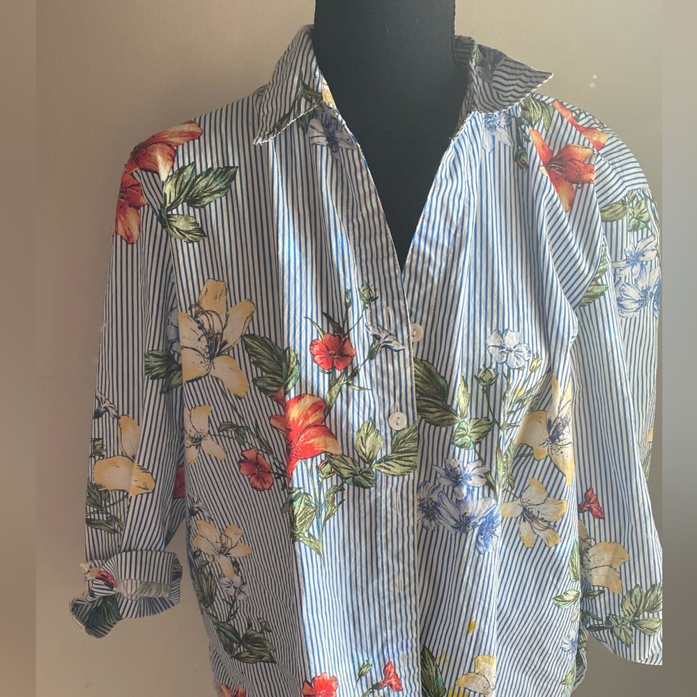 A cropped blue and white striped dress shirt with red and yellow Hawaiian